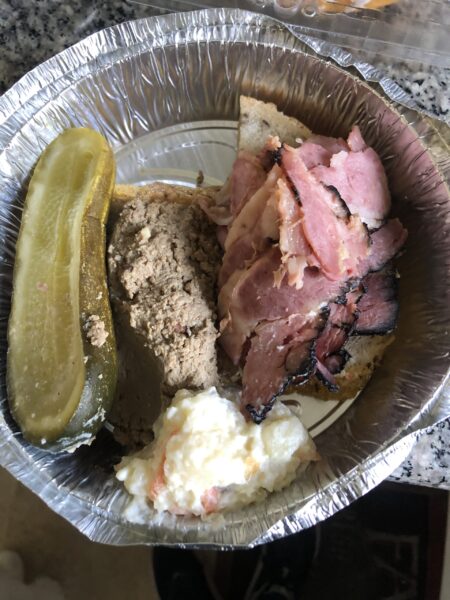 Chopped liver and pastrami and a pickle